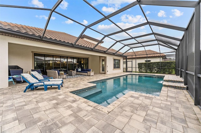 view of swimming pool with a lanai, an outdoor living space, and a patio