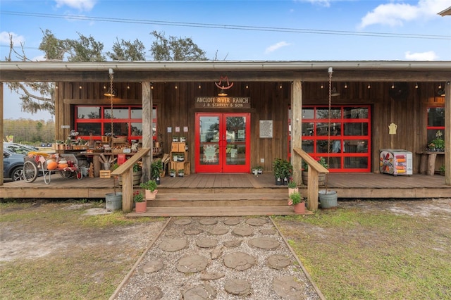 property entrance featuring french doors