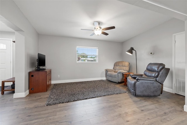 sitting room featuring ceiling fan and light hardwood / wood-style floors