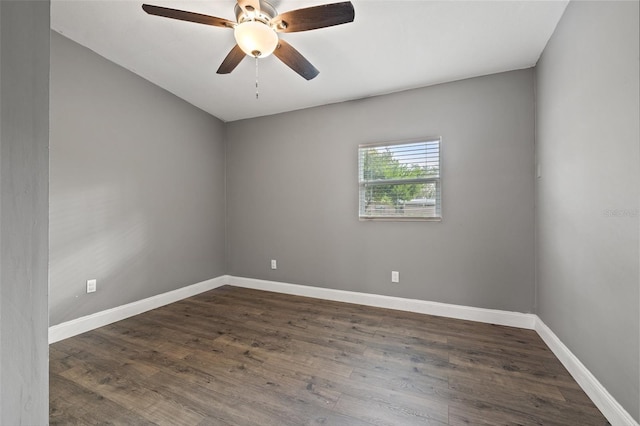 empty room featuring ceiling fan and dark hardwood / wood-style flooring