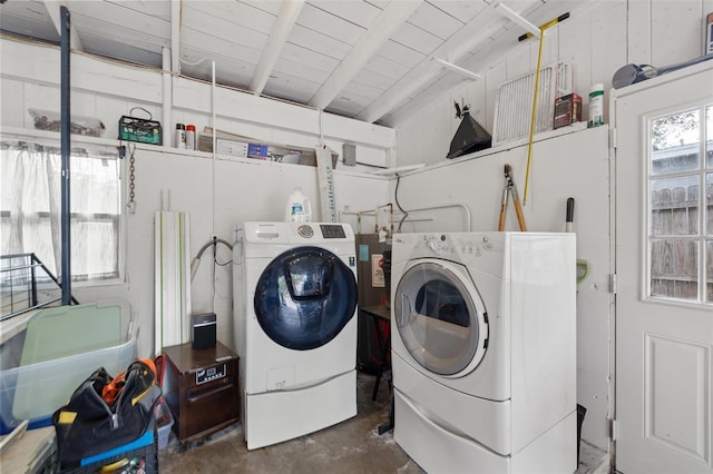 laundry area with wooden ceiling and washer and dryer