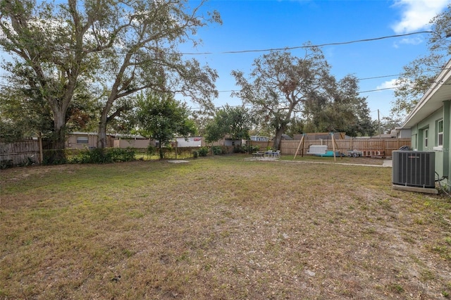 view of yard featuring central AC unit