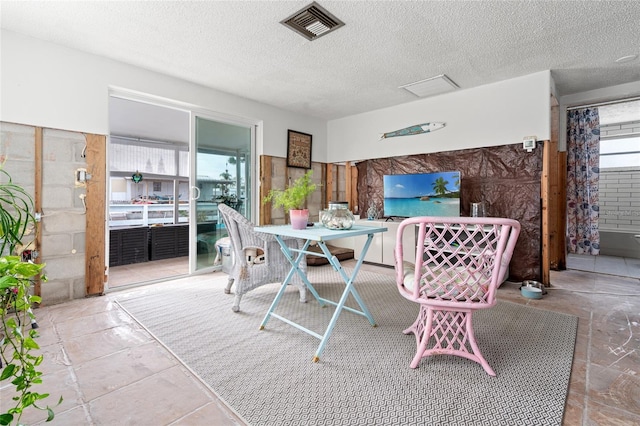 dining area with a textured ceiling