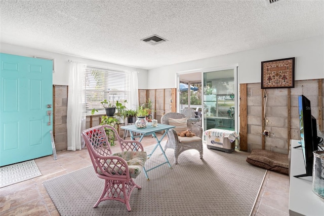 interior space with a textured ceiling