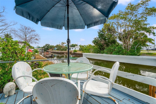 wooden deck with a water view