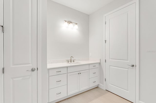 bathroom with hardwood / wood-style flooring and vanity