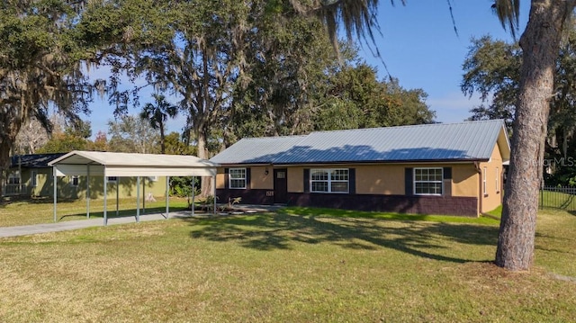 ranch-style home with a front yard and a carport