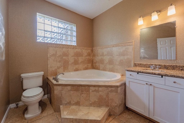 bathroom featuring a relaxing tiled tub, tile patterned floors, toilet, and vanity