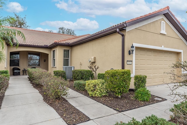 view of side of property with a garage