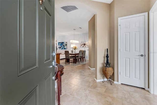 foyer featuring light tile patterned floors