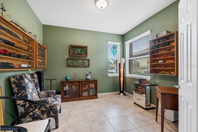 living area with light tile patterned floors