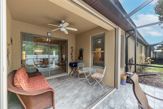 sunroom / solarium with ceiling fan