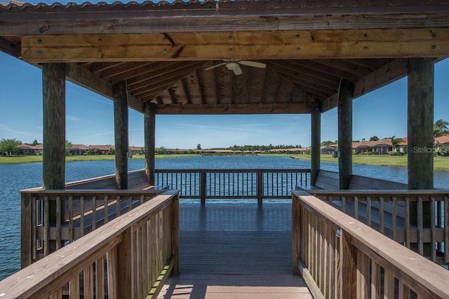 view of dock featuring a gazebo and a water view