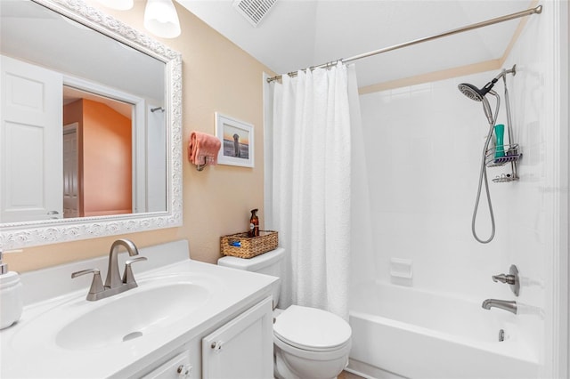 full bathroom featuring shower / bath combo with shower curtain, toilet, and vanity