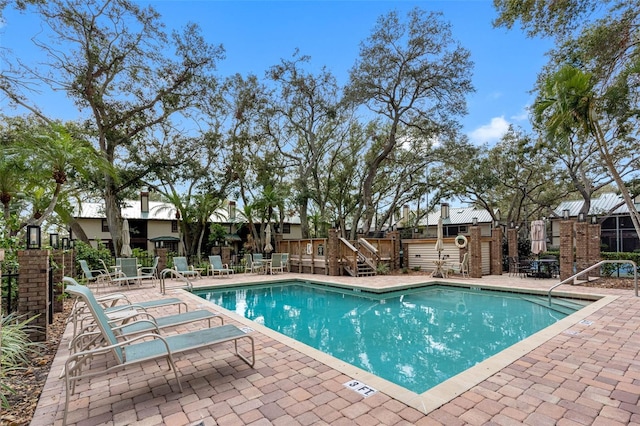 view of swimming pool featuring a patio