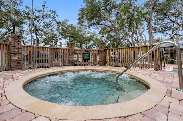 view of pool with a community hot tub