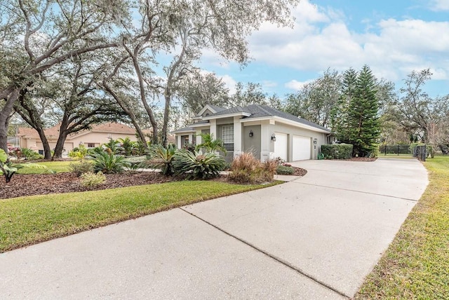 view of front of home featuring a front lawn and a garage