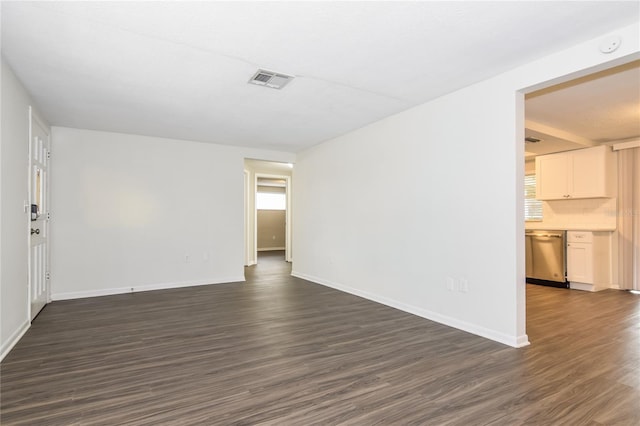 spare room with dark wood-type flooring