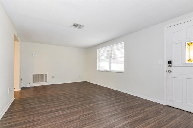 foyer with dark wood-type flooring