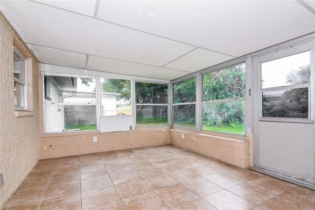 unfurnished sunroom with a wealth of natural light