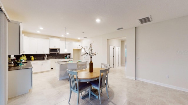 tiled dining area with sink