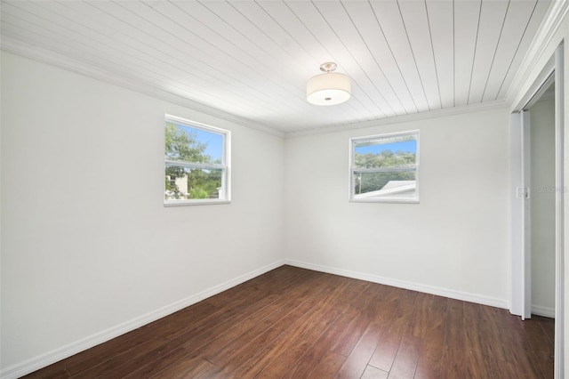 empty room with wooden ceiling, dark hardwood / wood-style floors, and crown molding