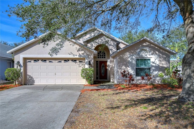 view of front of property with a garage