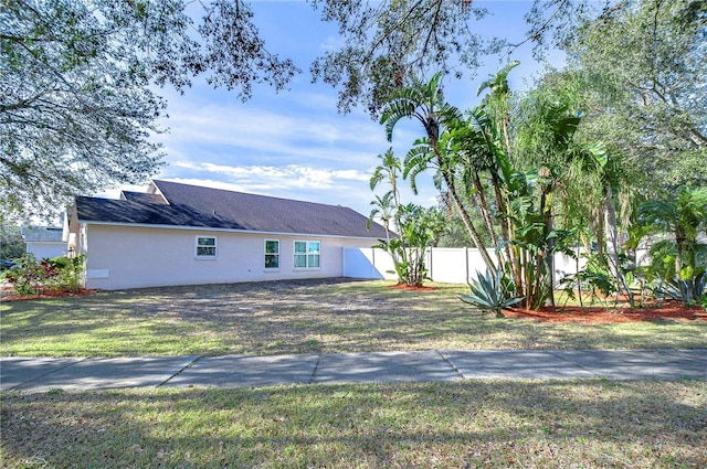 view of home's exterior featuring a yard