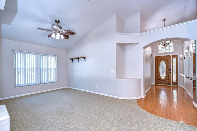 foyer entrance with ceiling fan, high vaulted ceiling, and a wealth of natural light