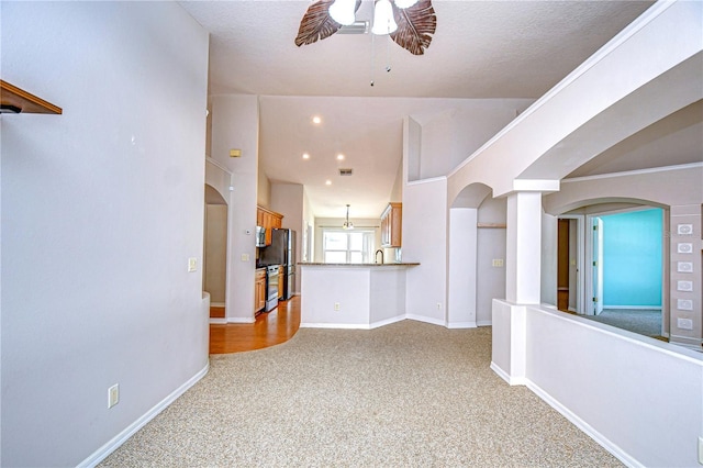 interior space with ceiling fan and sink