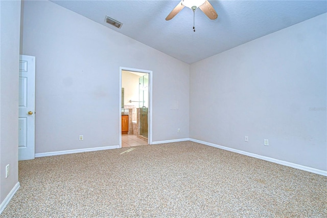 unfurnished room with lofted ceiling, light carpet, a textured ceiling, and ceiling fan