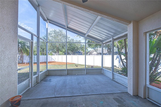 unfurnished sunroom with lofted ceiling