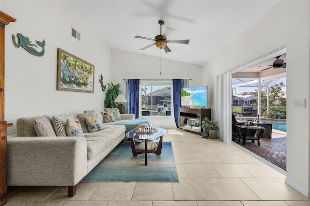 living area with a ceiling fan, a sunroom, visible vents, and a healthy amount of sunlight