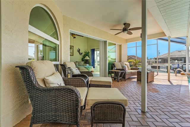 sunroom with ceiling fan