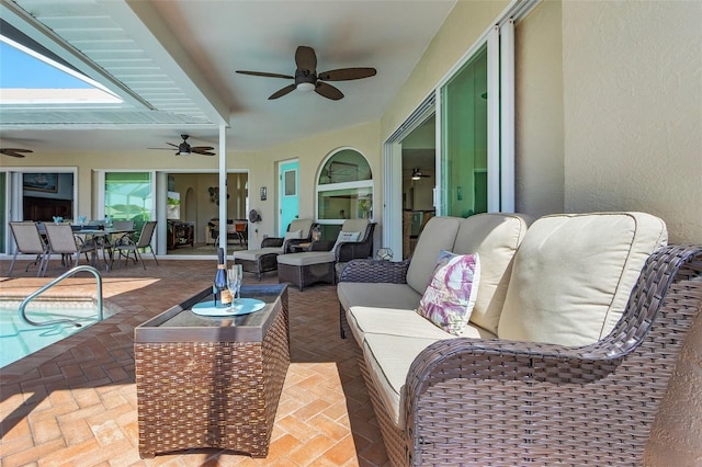 view of patio / terrace featuring a ceiling fan, outdoor dining area, an outdoor pool, and an outdoor living space