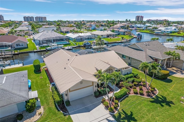 birds eye view of property featuring a water view and a residential view