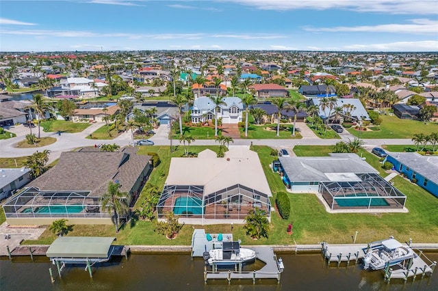 aerial view featuring a water view and a residential view