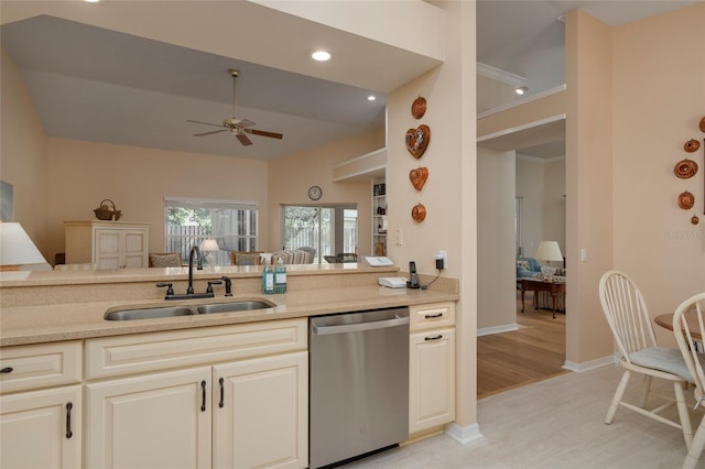 kitchen featuring dishwasher, sink, light hardwood / wood-style flooring, ceiling fan, and cream cabinetry