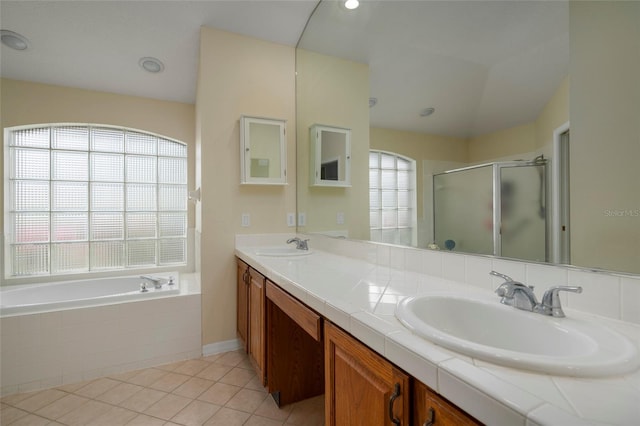 bathroom featuring plus walk in shower, tile patterned floors, and vanity