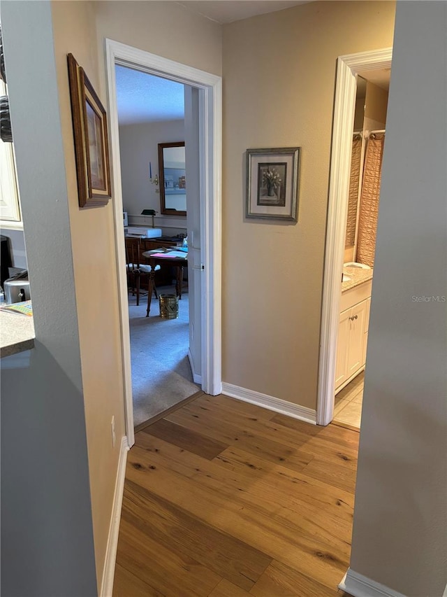 hallway featuring light wood-type flooring