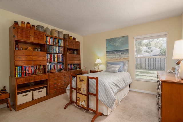 bedroom featuring light colored carpet