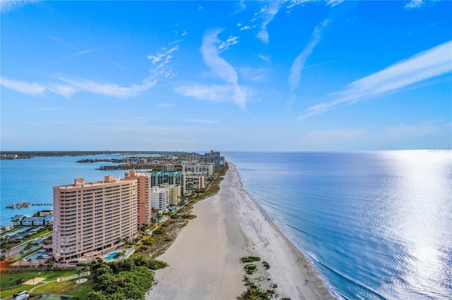 bird's eye view with a water view and a view of the beach