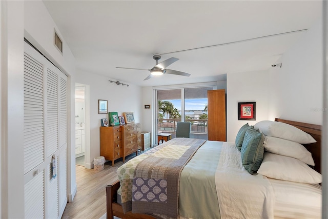 bedroom with ceiling fan, access to exterior, light hardwood / wood-style flooring, and a closet