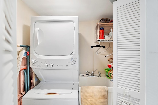 laundry room featuring stacked washer / dryer