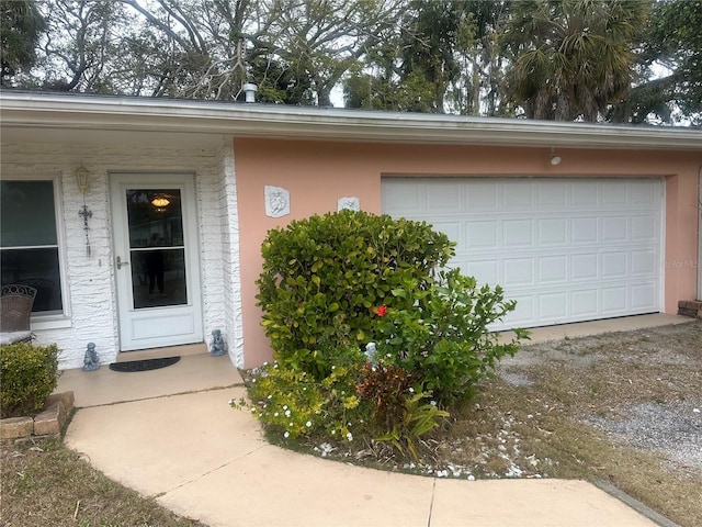 entrance to property featuring a garage