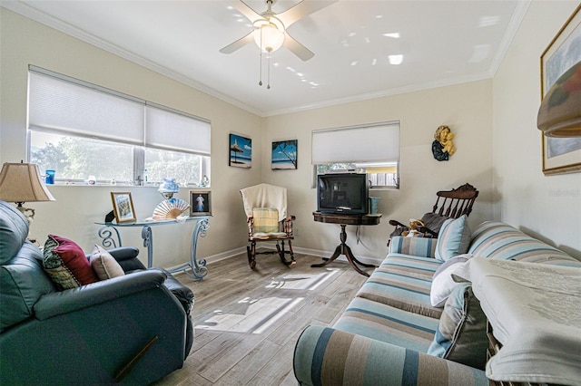 living room with crown molding, ceiling fan, and light hardwood / wood-style floors