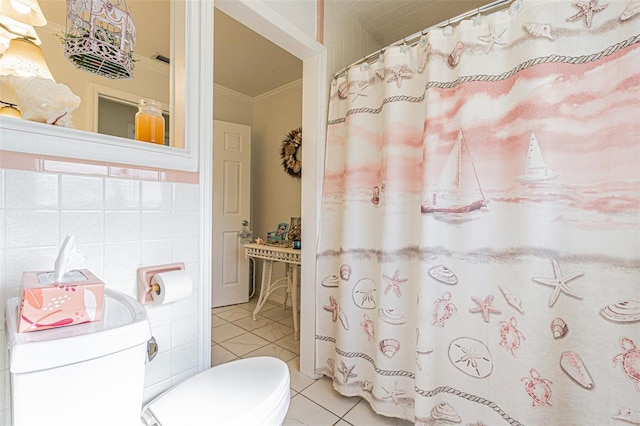 bathroom featuring crown molding, tile patterned floors, toilet, and tile walls