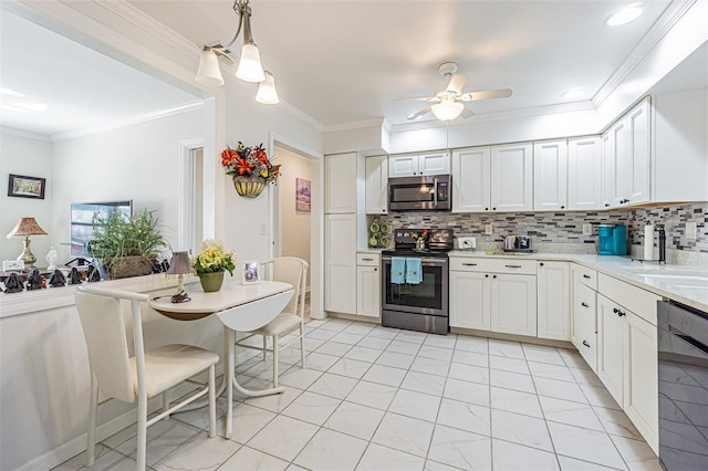 kitchen with stainless steel appliances, white cabinetry, crown molding, and decorative light fixtures