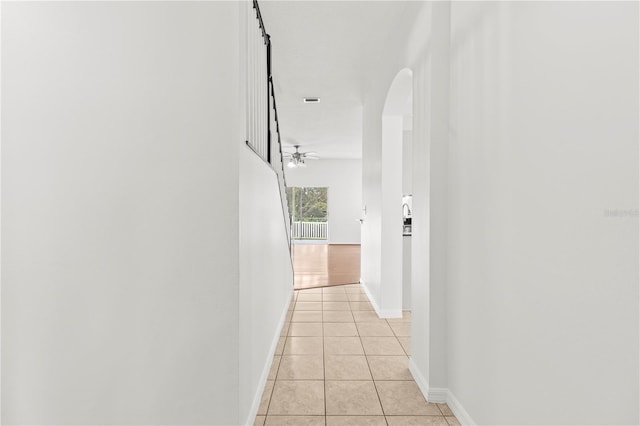 corridor featuring light tile patterned flooring