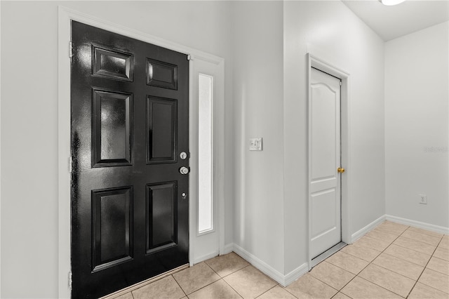 entrance foyer with light tile patterned floors